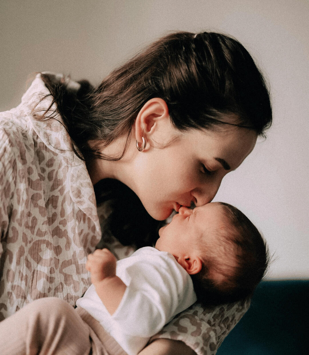 Mother kissing a baby